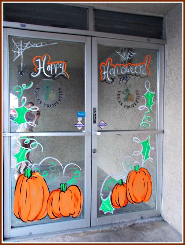 Halloween window painting, pumpkins, spiders, web, orange, green, leaves