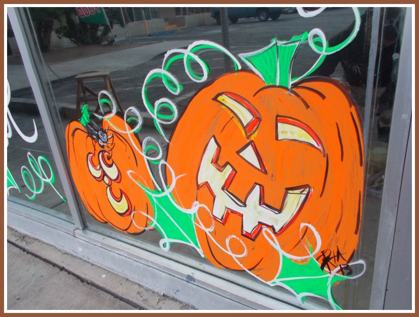 Painted Jack O' Lanterns dress up an office window