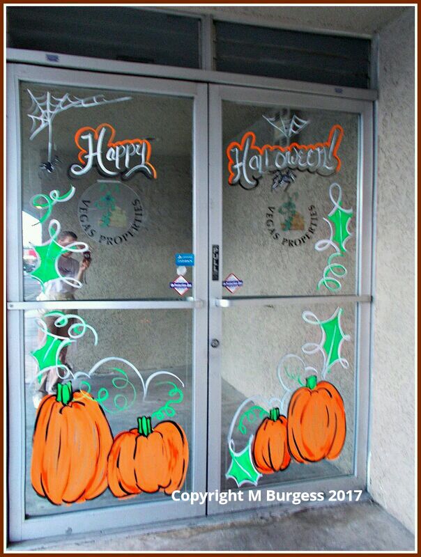 Halloween door border decorations with lettering, pumpkins, and spiders