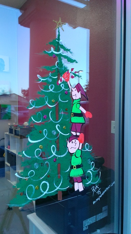 Elves decorating Christmas tree